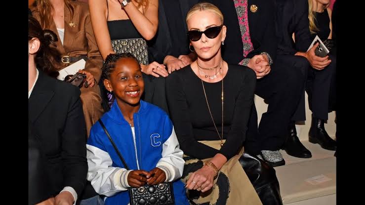 BREAKING NEWS: Charlize Theron’s daughter August makes rare public appearance at the Dior pre-fall 2024 show in New York City…see more…