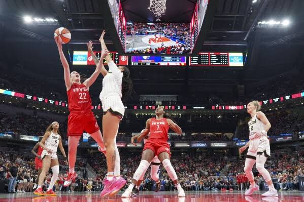 Caitlin Clark opened the WNBA season with 20 points, 10 rebounds and 10 assists in the Indiana Fever’s 93-58 win over the Chicago Sky.